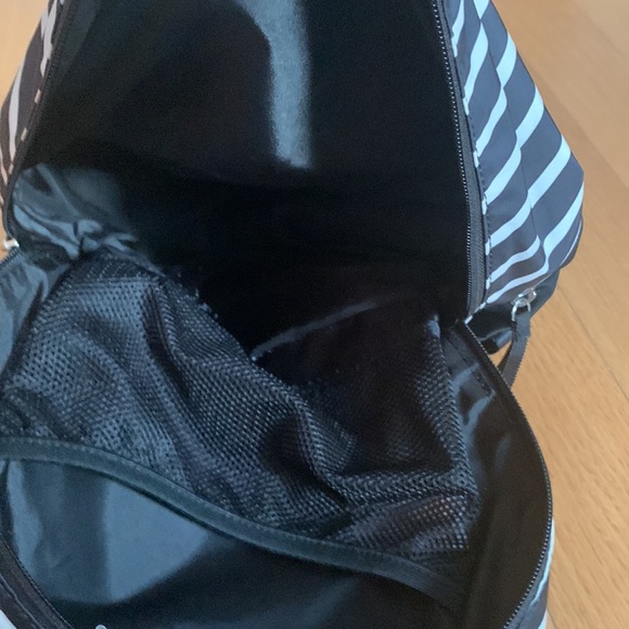 This is a black and white stripped mini backpack from Ivivva. - Picture 2 of 5